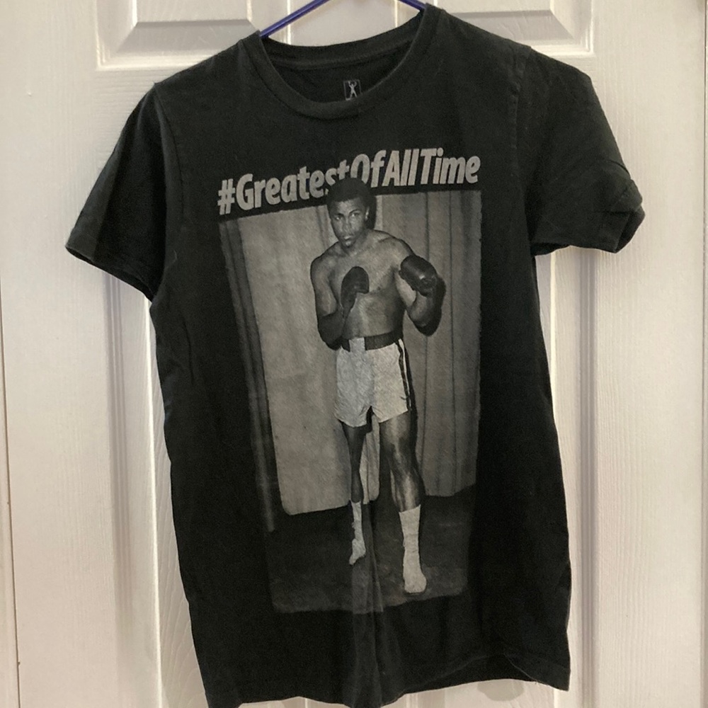 Never worn. Black Muhammad Ali t-shirt. Men’s size small.